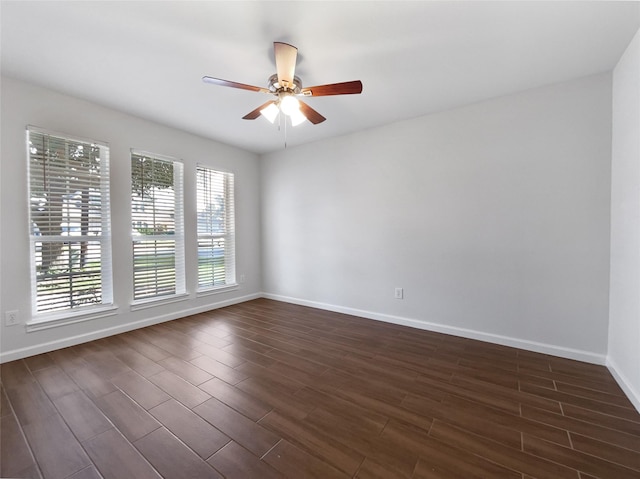 2317 Shady Pine Dr, Conroe, TX 77301 - spare room featuring ceiling fan and dark wood-style floors