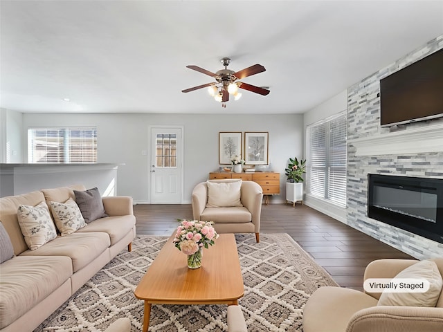2317 Shady Pine Dr, Conroe, TX 77301 - living room featuring a ceiling fan, wood finished floors, and a large fireplace
