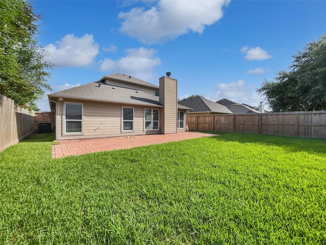 2317 Shady Pine Dr, Conroe, TX 77301 - rear view of house featuring a patio, a fenced backyard, and a chimney