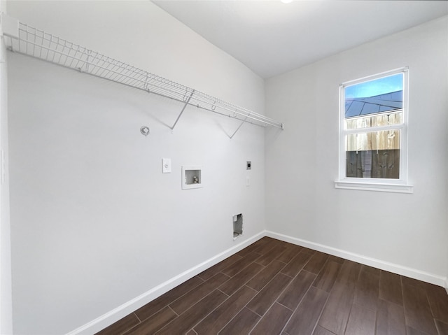 2317 Shady Pine Dr, Conroe, TX 77301 - laundry room with hookup for an electric dryer, dark wood-style floors, washer hookup, and hookup for a gas dryer