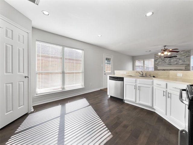 2317 Shady Pine Dr, Conroe, TX 77301 - kitchen featuring dishwasher, white cabinetry, light countertops, dark wood-style flooring, and recessed lighting
