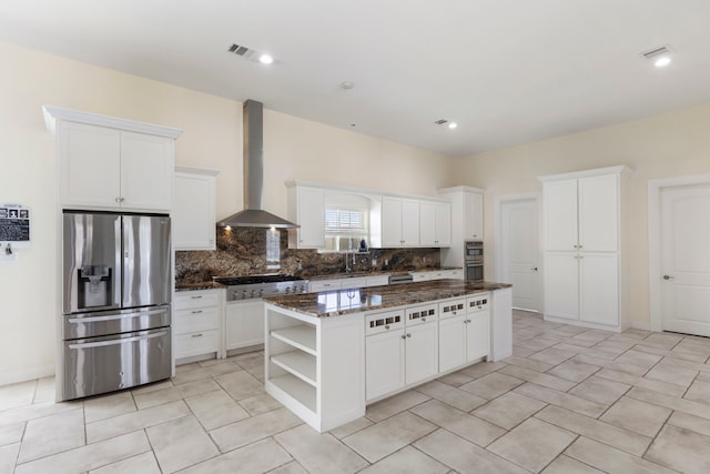 2464 N Walker Rd, Cleveland, TX 77328 - kitchen with stainless steel appliances, wall chimney exhaust hood, open shelves, a center island, and backsplash