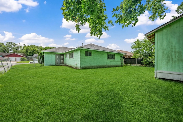 11302 Murr Way, Houston, TX 77048 - rear view of property with a fenced backyard, brick siding, french doors, and a shingled roof