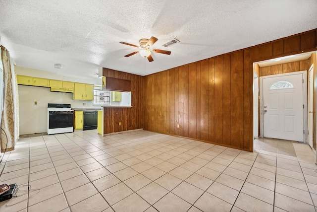 11302 Murr Way, Houston, TX 77048 - kitchen with white stove, dishwasher, a ceiling fan, wooden walls, and light countertops