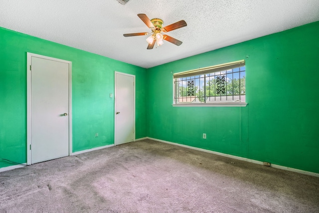 11302 Murr Way, Houston, TX 77048 - unfurnished bedroom with carpet flooring, a textured ceiling, and a ceiling fan
