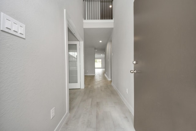 15819 Walnut Leaf Ln, Cypress, TX 77429 - hall with light wood-style floors and a textured wall