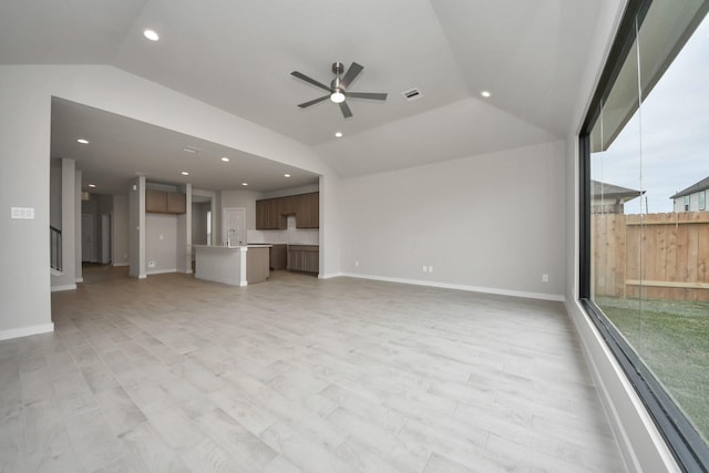 15819 Walnut Leaf Ln, Cypress, TX 77429 - unfurnished living room featuring lofted ceiling, ceiling fan, recessed lighting, and plenty of natural light