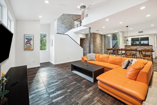 6532 Community Dr, West University Place, TX 77005 - living room featuring healthy amount of natural light, recessed lighting, ceiling fan, stairway, and a high ceiling