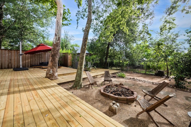 6532 Community Dr, West University Place, TX 77005 - deck with an outdoor fire pit, a fenced backyard, and a patio area