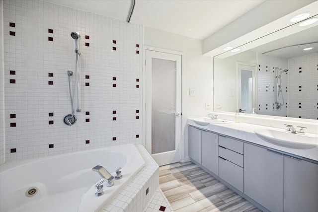 6532 Community Dr, West University Place, TX 77005 - full bathroom featuring double vanity and tiled shower / bath combo