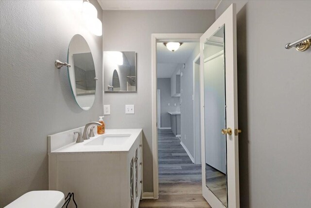 4747 Nasa Pkwy Unit 110, Seabrook, TX 77586 - bathroom featuring vanity and wood finished floors