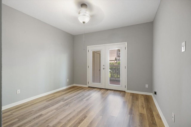 4747 Nasa Pkwy Unit 110, Seabrook, TX 77586 - empty room featuring french doors, wood finished floors, and a ceiling fan