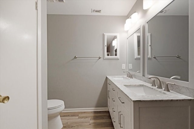4747 Nasa Pkwy Unit 110, Seabrook, TX 77586 - bathroom featuring wood finished floors and double vanity