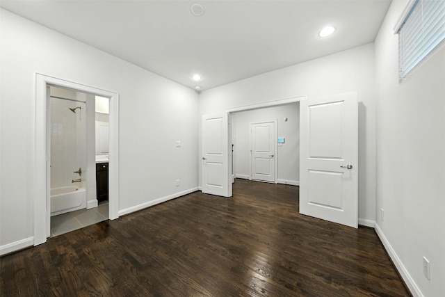 4106 Schuler St, Houston, TX 77007 - unfurnished bedroom with dark wood-style flooring, ensuite bath, and recessed lighting