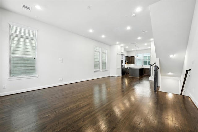 4106 Schuler St, Houston, TX 77007 - unfurnished living room featuring dark wood-style flooring and recessed lighting
