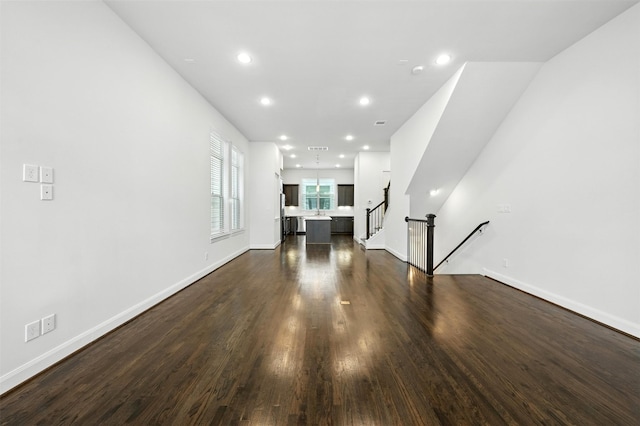 4106 Schuler St, Houston, TX 77007 - unfurnished living room featuring dark wood-type flooring, recessed lighting, and stairway