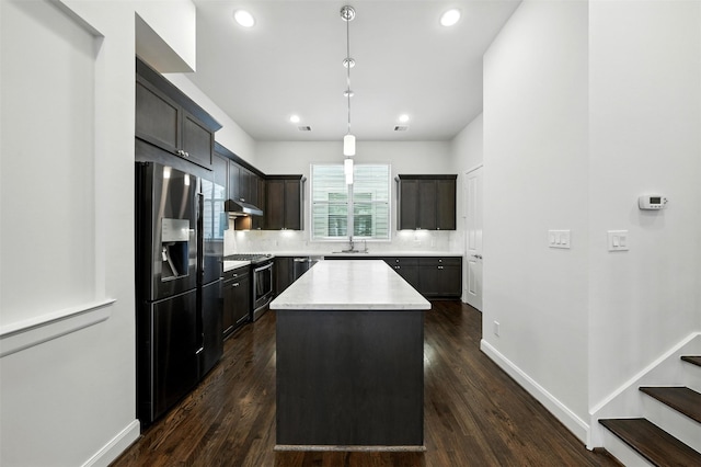 4106 Schuler St, Houston, TX 77007 - kitchen featuring refrigerator with ice dispenser, gas stove, under cabinet range hood, a kitchen island, and recessed lighting