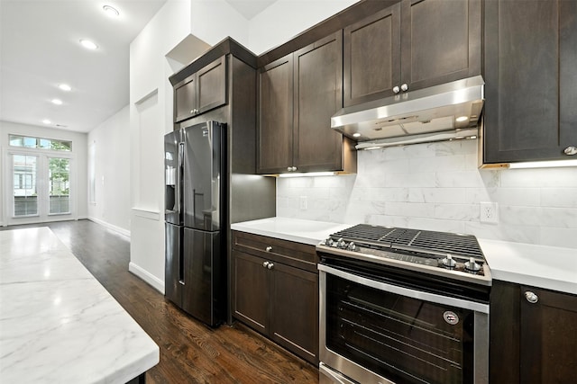 4106 Schuler St, Houston, TX 77007 - kitchen with appliances with stainless steel finishes, under cabinet range hood, tasteful backsplash, dark brown cabinetry, and recessed lighting
