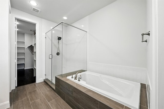 4106 Schuler St, Houston, TX 77007 - full bath with a garden tub, a shower stall, a walk in closet, and recessed lighting