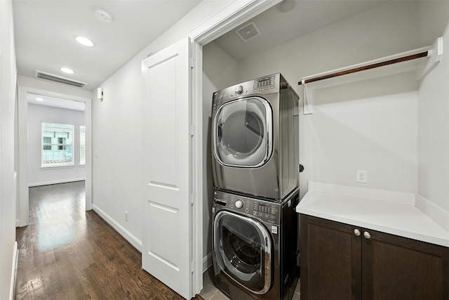 4106 Schuler St, Houston, TX 77007 - laundry area with stacked washing machine and dryer, dark wood-style flooring, and recessed lighting