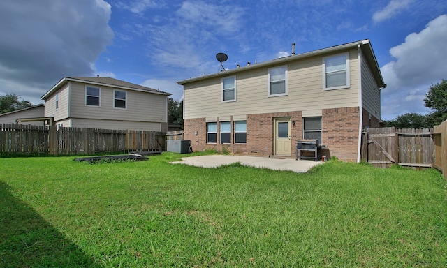 29406 Legends Stone Dr, Spring, TX 77386 - back of house with brick siding, a patio, and a fenced backyard