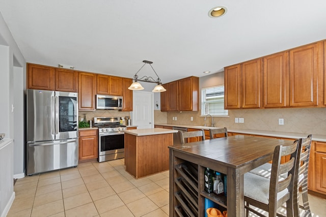 29406 Legends Stone Dr, Spring, TX 77386 - kitchen with appliances with stainless steel finishes, light countertops, brown cabinetry, light tile patterned floors, and decorative backsplash