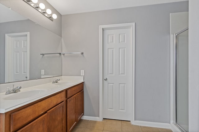 29406 Legends Stone Dr, Spring, TX 77386 - bathroom with a stall shower, double vanity, and tile patterned flooring