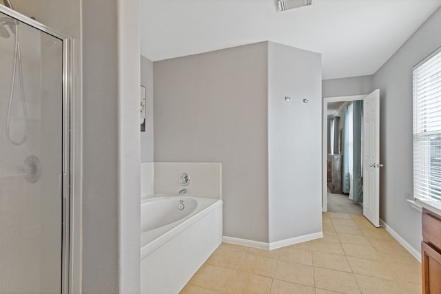 29406 Legends Stone Dr, Spring, TX 77386 - full bath featuring a stall shower, vanity, a garden tub, tile patterned flooring, and healthy amount of natural light