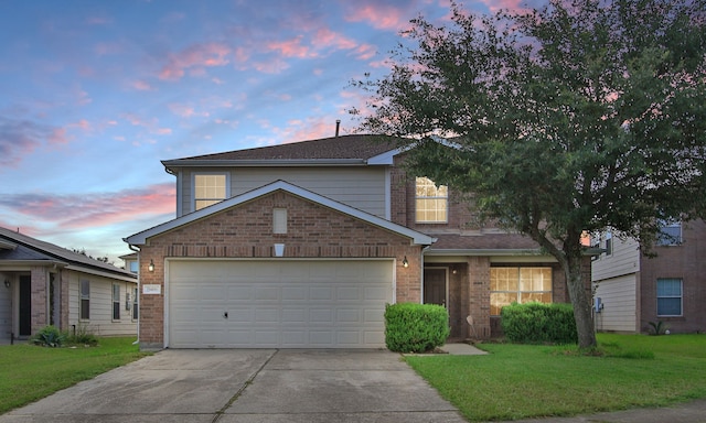 29406 Legends Stone Dr, Spring, TX 77386 - traditional-style house featuring brick siding, driveway, an attached garage, and a lawn