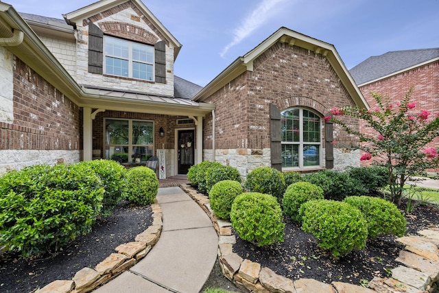 14107 Park Antique Ln, Cypress, TX 77429 - entrance to property featuring brick siding, a standing seam roof, a metal roof, and a shingled roof