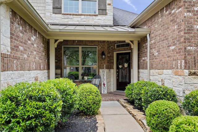 14107 Park Antique Ln, Cypress, TX 77429 - view of exterior entry featuring a standing seam roof, covered porch, a metal roof, and a shingled roof