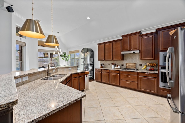 14107 Park Antique Ln, Cypress, TX 77429 - kitchen with decorative backsplash, appliances with stainless steel finishes, vaulted ceiling, light tile patterned floors, and decorative light fixtures