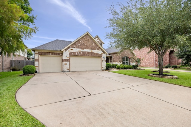 14107 Park Antique Ln, Cypress, TX 77429 - view of front of home with brick siding, a garage, driveway, and a shingled roof