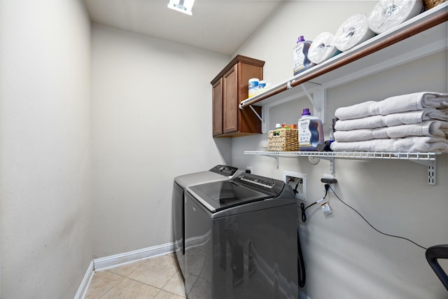 14107 Park Antique Ln, Cypress, TX 77429 - laundry room with cabinet space, washing machine and dryer, and light tile patterned floors