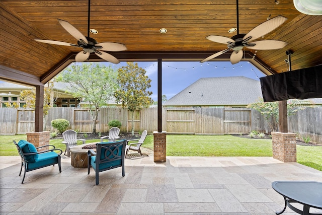 14107 Park Antique Ln, Cypress, TX 77429 - fenced backyard with ceiling fan, a fire pit, and a patio