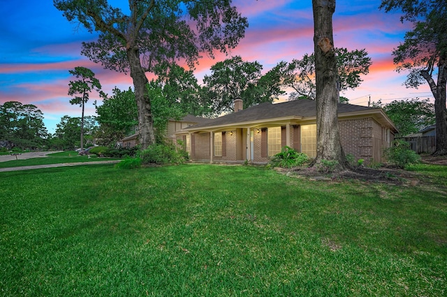 510 Shenandoah Dr, Shenandoah, TX 77381 - view of front of house featuring brick siding, a front yard, and a chimney