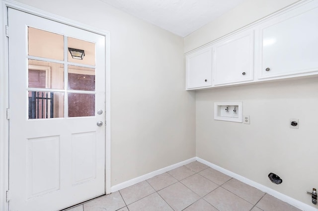 510 Shenandoah Dr, Shenandoah, TX 77381 - laundry area featuring washer hookup, hookup for an electric dryer, cabinet space, and light tile patterned flooring