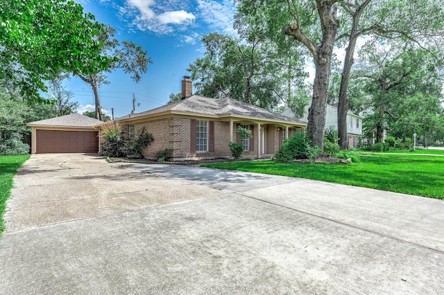 510 Shenandoah Dr, Shenandoah, TX 77381 - ranch-style house with driveway, a chimney, a front yard, brick siding, and an attached garage