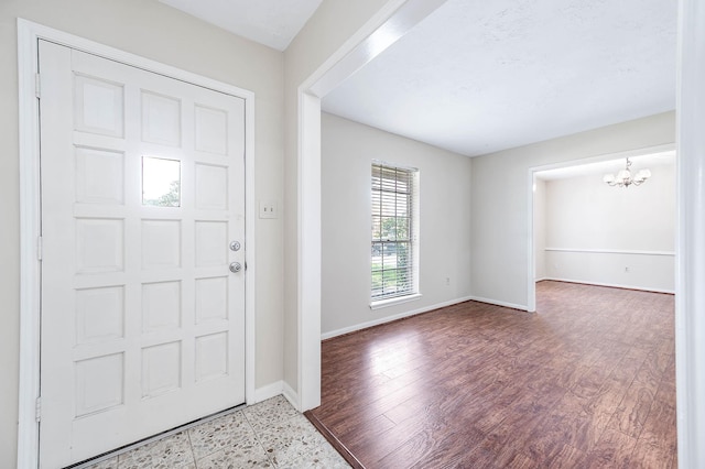 510 Shenandoah Dr, Shenandoah, TX 77381 - foyer with a chandelier and wood finished floors