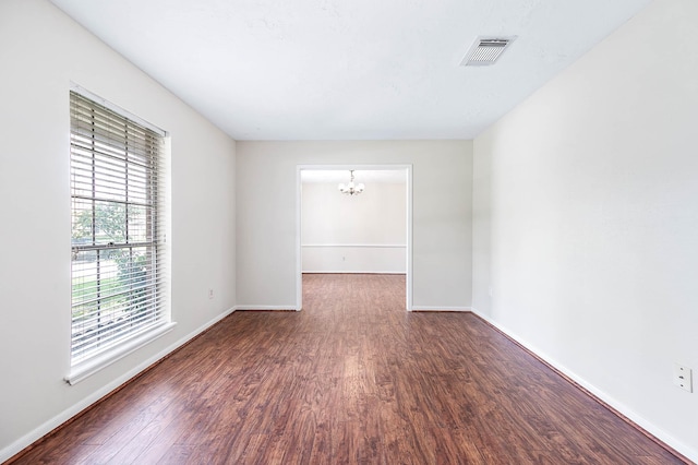 510 Shenandoah Dr, Shenandoah, TX 77381 - unfurnished room with wood finished floors and a chandelier