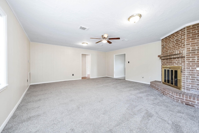 510 Shenandoah Dr, Shenandoah, TX 77381 - unfurnished living room featuring a ceiling fan, carpet flooring, a brick fireplace, and a textured ceiling