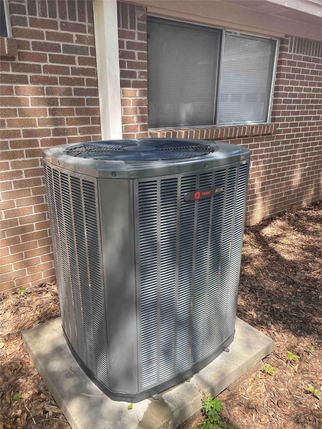 510 Shenandoah Dr, Shenandoah, TX 77381 - exterior view of brick siding and a central AC unit