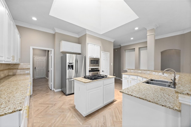 13718 Sherburn Manor Dr, Cypress, TX 77429 - kitchen featuring a large island with sink, appliances with stainless steel finishes, crown molding, recessed lighting, and backsplash