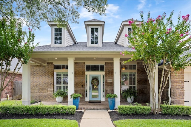 13718 Sherburn Manor Dr, Cypress, TX 77429 - view of front of house featuring brick siding, covered porch, and roof with shingles