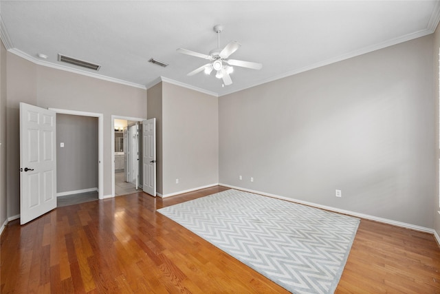 13718 Sherburn Manor Dr, Cypress, TX 77429 - unfurnished bedroom featuring wood finished floors, ornamental molding, a ceiling fan, and ensuite bath