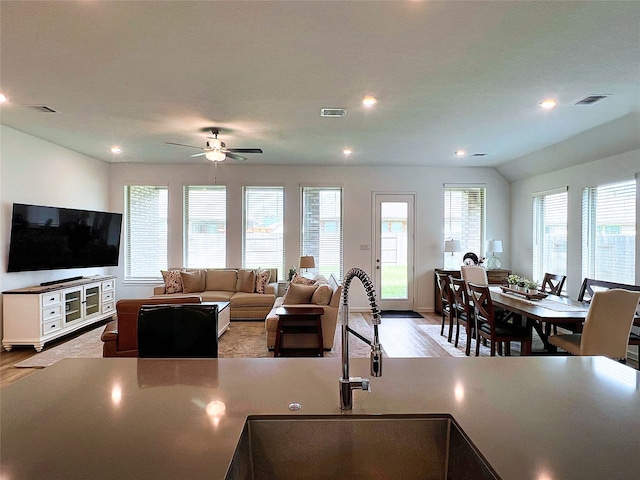 19022 Palizzi Ridge Ln, New Caney, TX 77357 - kitchen with wood finished floors, a ceiling fan, and recessed lighting