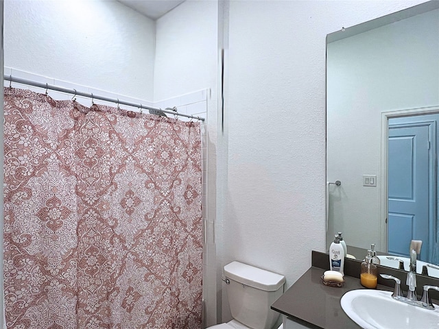 19022 Palizzi Ridge Ln, New Caney, TX 77357 - bathroom featuring vanity, a shower with curtain, and a textured wall