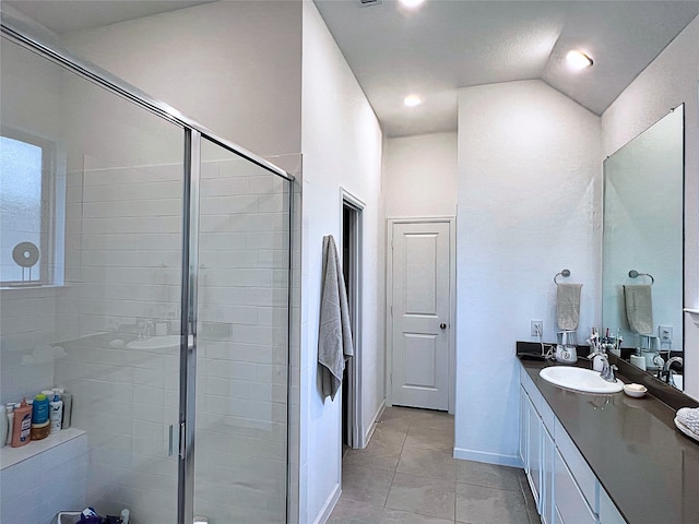 19022 Palizzi Ridge Ln, New Caney, TX 77357 - bathroom featuring a stall shower, vanity, tile patterned flooring, vaulted ceiling, and recessed lighting