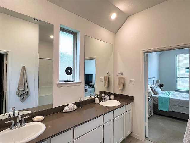 19022 Palizzi Ridge Ln, New Caney, TX 77357 - ensuite bathroom with double vanity and vaulted ceiling
