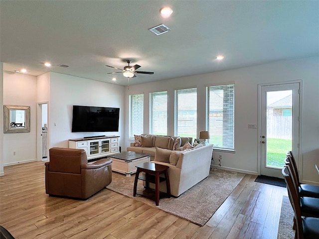 19022 Palizzi Ridge Ln, New Caney, TX 77357 - living area with light wood-style floors, a ceiling fan, and recessed lighting